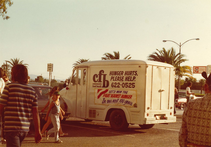 About Us image in the Our Roots section of community food bank distribution truck in the 1970s.